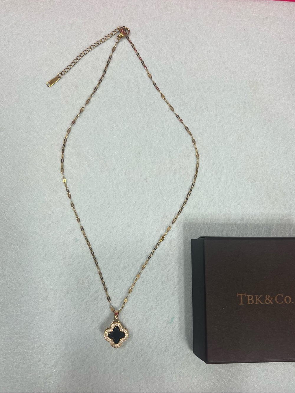 TBK & CO. Gold-tone Necklace with Black Clover Pendant